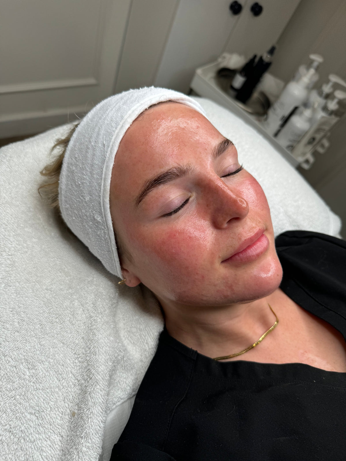A client relaxing during a skin treatment at CSKIN