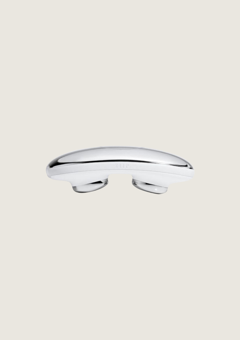 An at-home facial device combining microcurrent and nanocurrent to help skin look firmer, smoother and more lifted, with guided treatments through the ZIIP app.